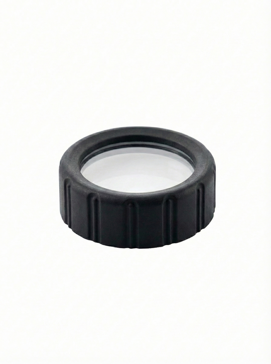Black circular lens cap with plastic center on a white background