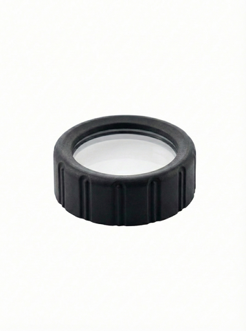 Black circular lens cap with plastic center on a white background